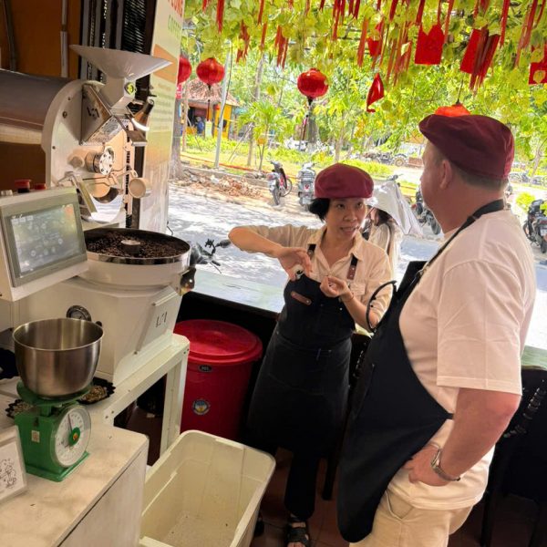 Guests learning Vietnamese coffee roasting at Tri Long Roastery in Hoi An