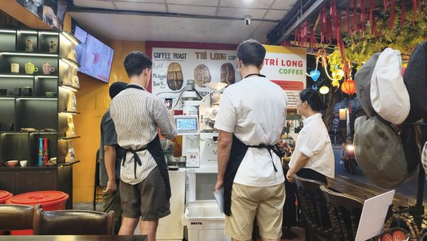 Guests learning Vietnamese coffee roasting at Tri Long Roastery in Hoi An