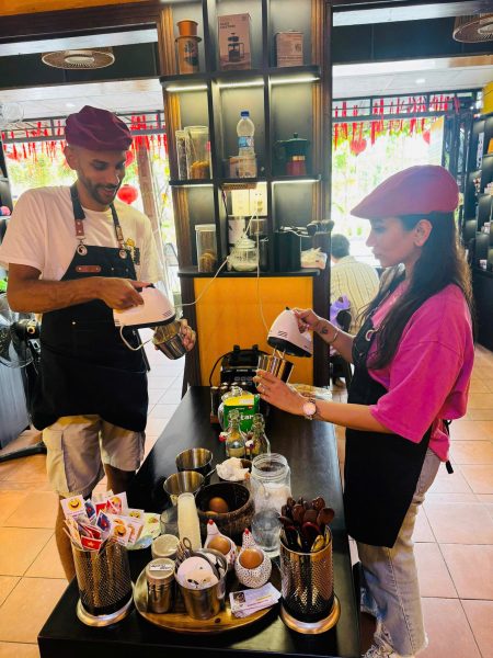 Traveler making Vietnamese coffee at a Hoi An coffee class