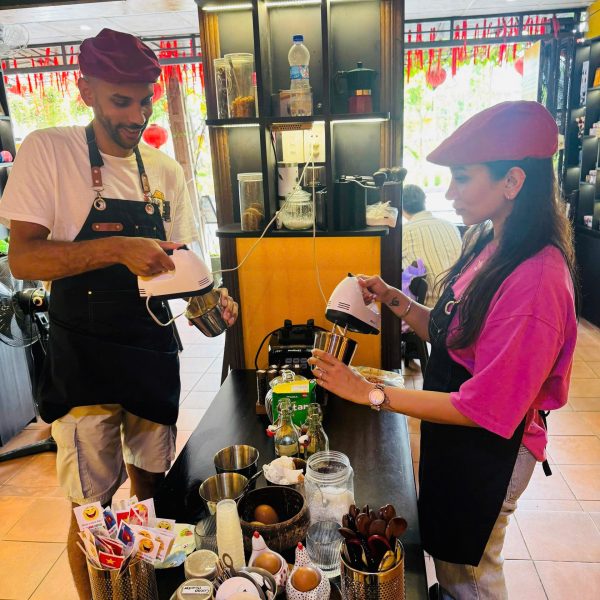 Traveler making Vietnamese coffee at a Hoi An coffee class