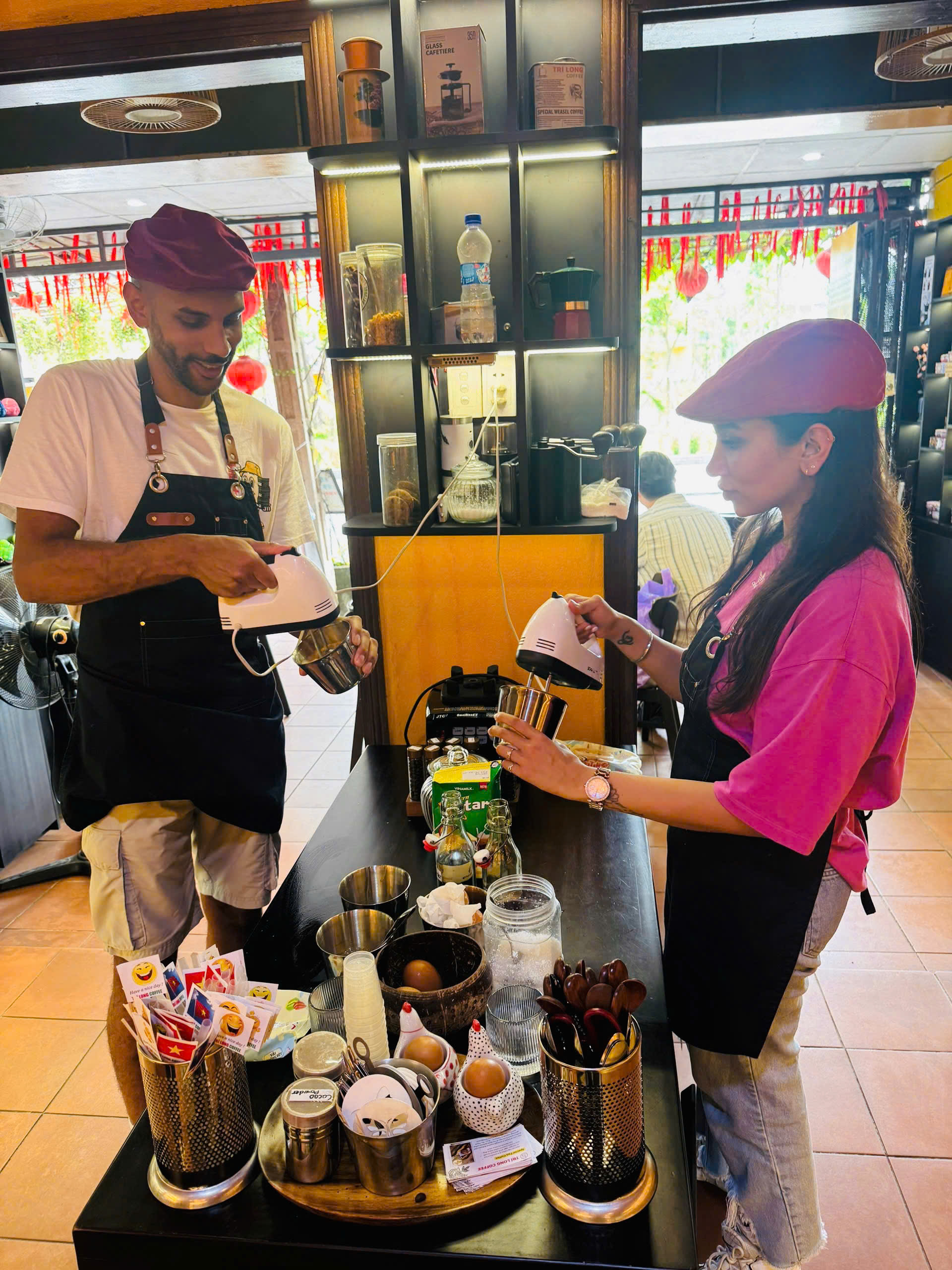 Traveler making Vietnamese coffee at a Hoi An coffee class