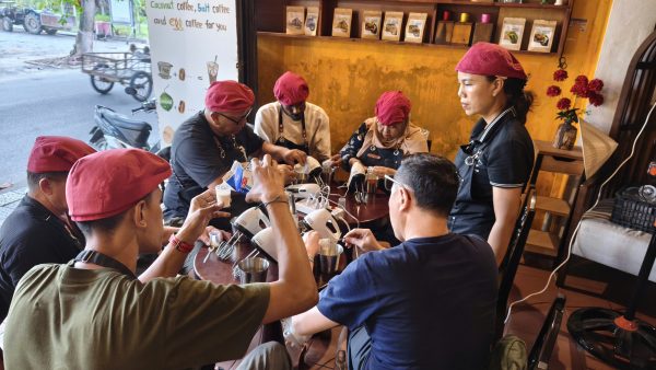 Visitors learning Vietnamese coffee making in Hoi An