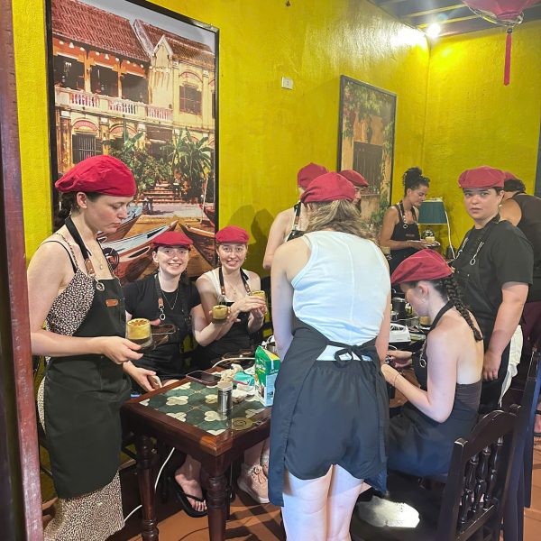 Guest making Vietnamese Egg Coffee at Tri Long Coffee Roastery in Hoi An