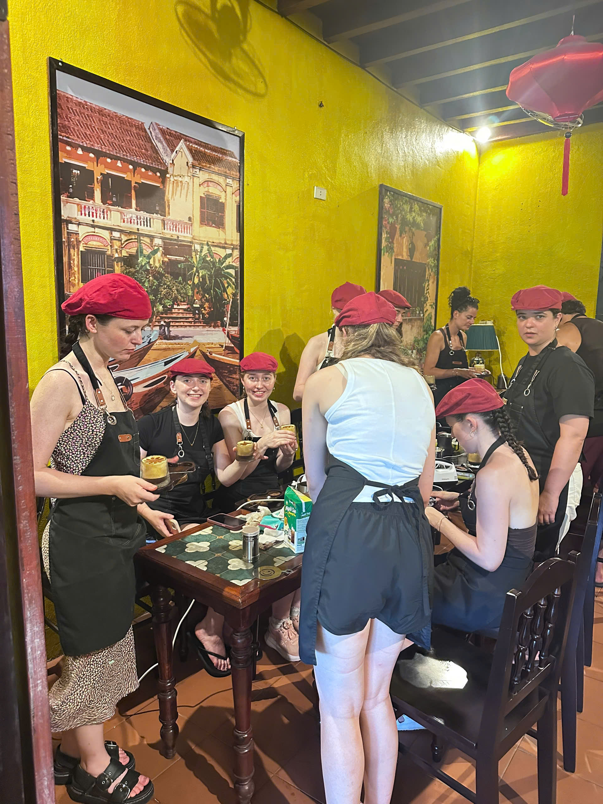 Guest making Vietnamese Egg Coffee at Tri Long Coffee Roastery in Hoi An