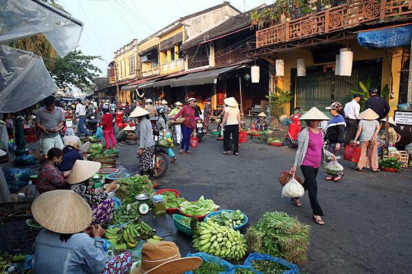 Hoi An local market with fresh vegetables seafood and Vietnamese vendors