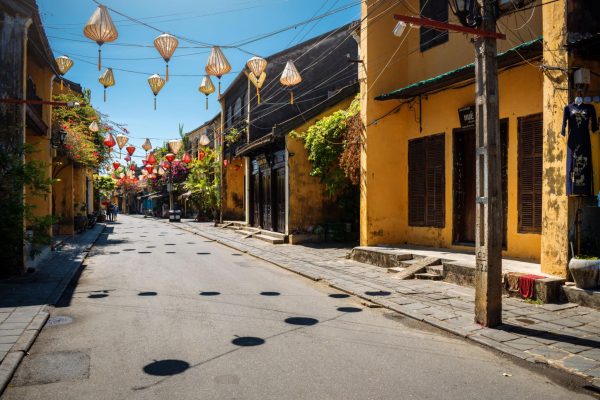 Quiet street in Hoi An with traditional houses and few tourists
