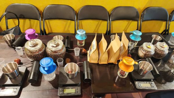 Packing freshly roasted coffee during an advanced coffee roasting class in Hoi An