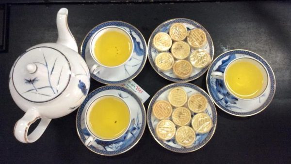 Tasting Vietnamese herbal tea and enjoying its aroma
