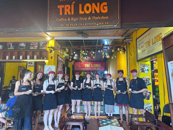 Group of guests learning about coffee roasting at Tri Long Coffee Roastery in Hoi An