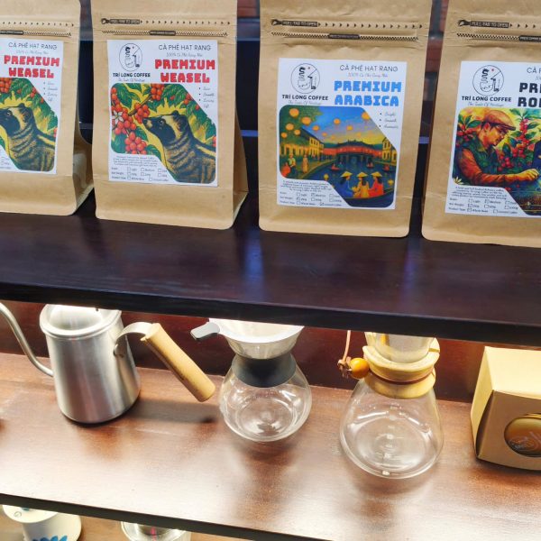Packing freshly roasted coffee during an advanced coffee roasting class in Hoi An