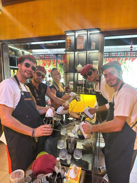 Guest whisking eggs during a Vietnamese coffee making class in Hoi An