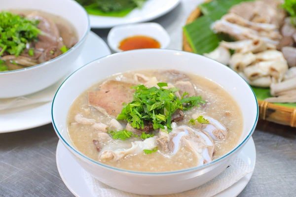 Vietnamese chao long rice porridge with pork offal and blood sausage
