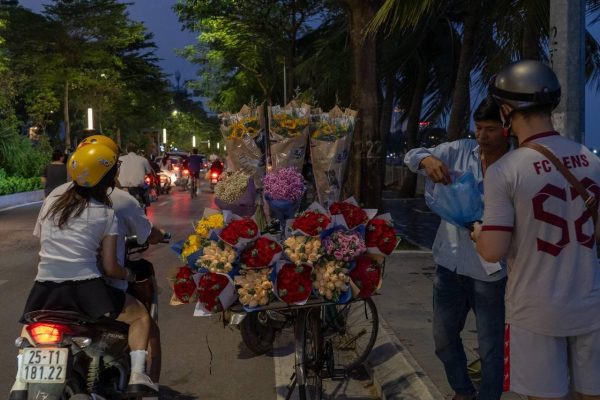 Flower stalls displaying bouquets on a street in Vietnam around October 20
