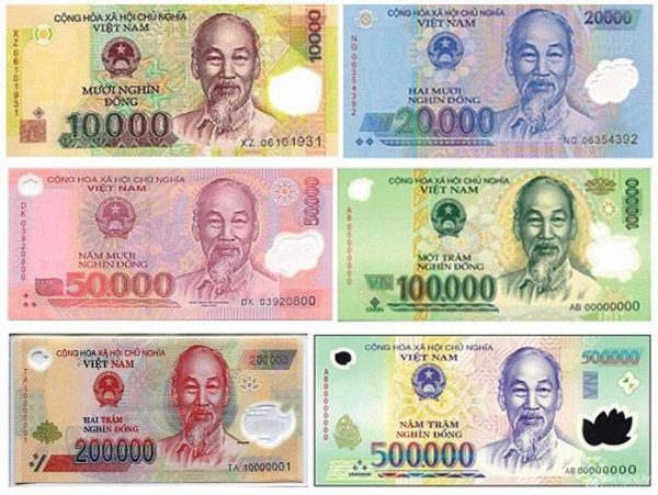 Vietnamese dong banknotes in different denominations, including 20,000, 50,000, 100,000 and 500,000 VND